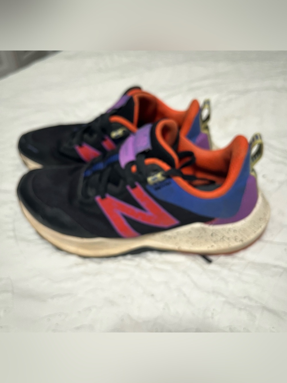 New Balance Black Sneakers with Red, Purple & Orange Accents